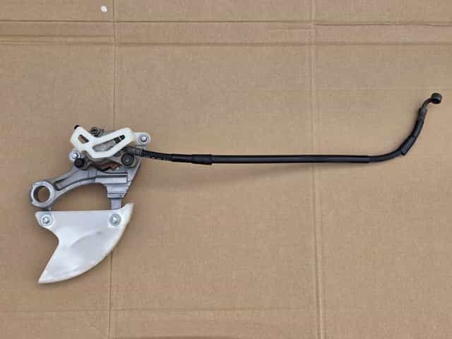 Tył tylny zacisk hamulcowy Kawasaki KX KXF 250 / 450 OEM ! + przewód