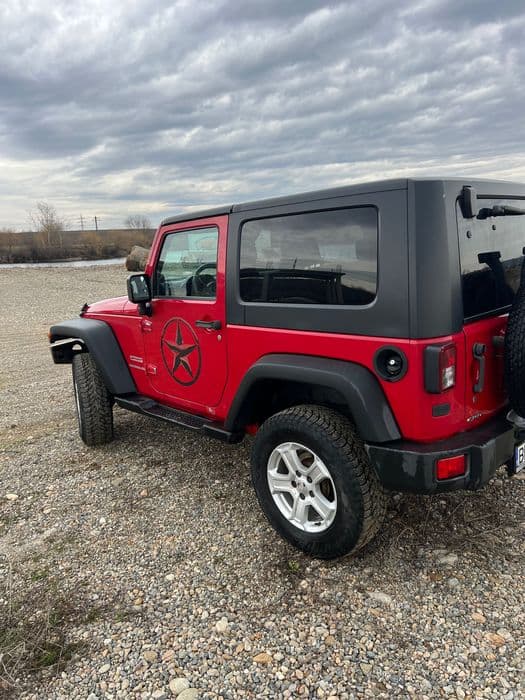 Vând Jeep Wrangler sport .