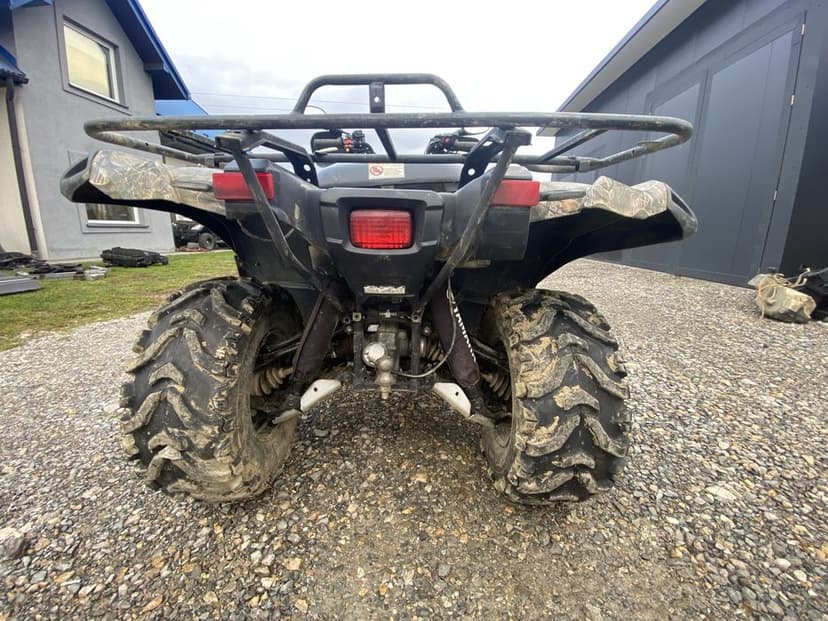 Zderzak grill lampa wahacz piasta zwrotnica połośka grizzly 700/550