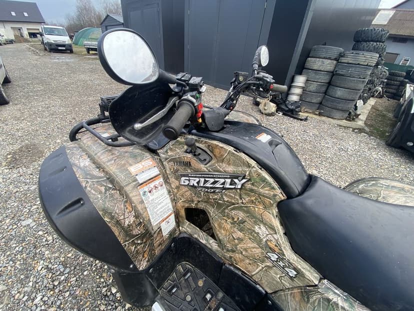 Zderzak grill lampa wahacz piasta zwrotnica połośka grizzly 700/550
