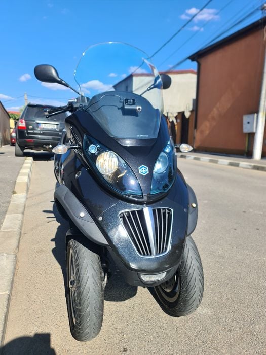 Piaggio mp3 250i se conduce cu B