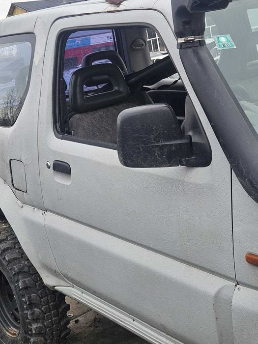 Usa dezechipata stanga/dreapta fata Suzuki Jimny 2003