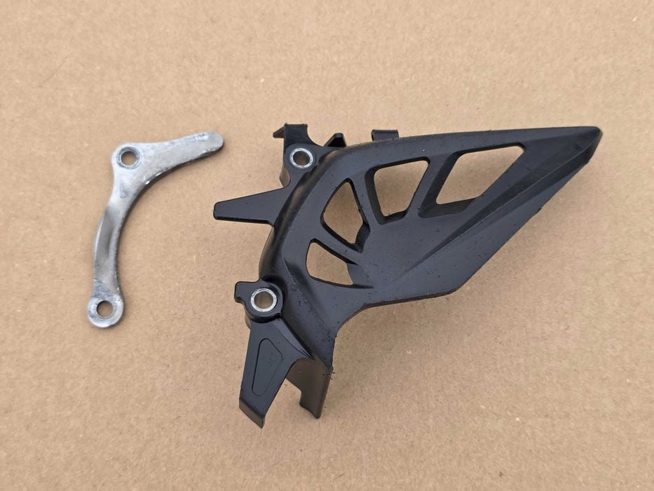 Osłona przedniej zębatki Honda CRF 250 r. 10-17 / CRF 450 r. 09-16 OEM