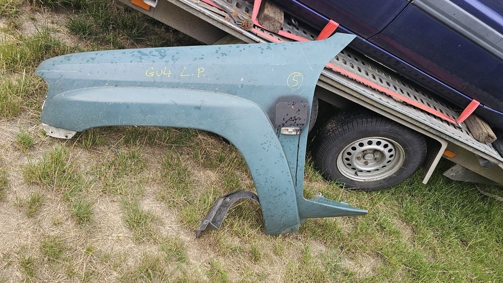 Nissan Patrol y61 GU4 błotnik lewy przód